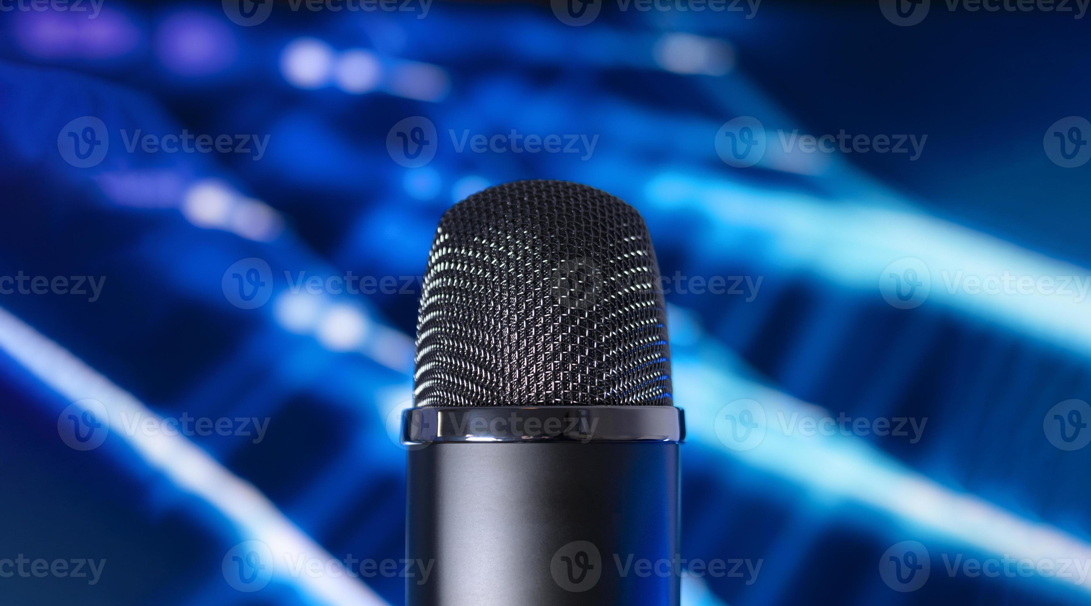 Condenser microphone on a blue tech background. Podcast concept