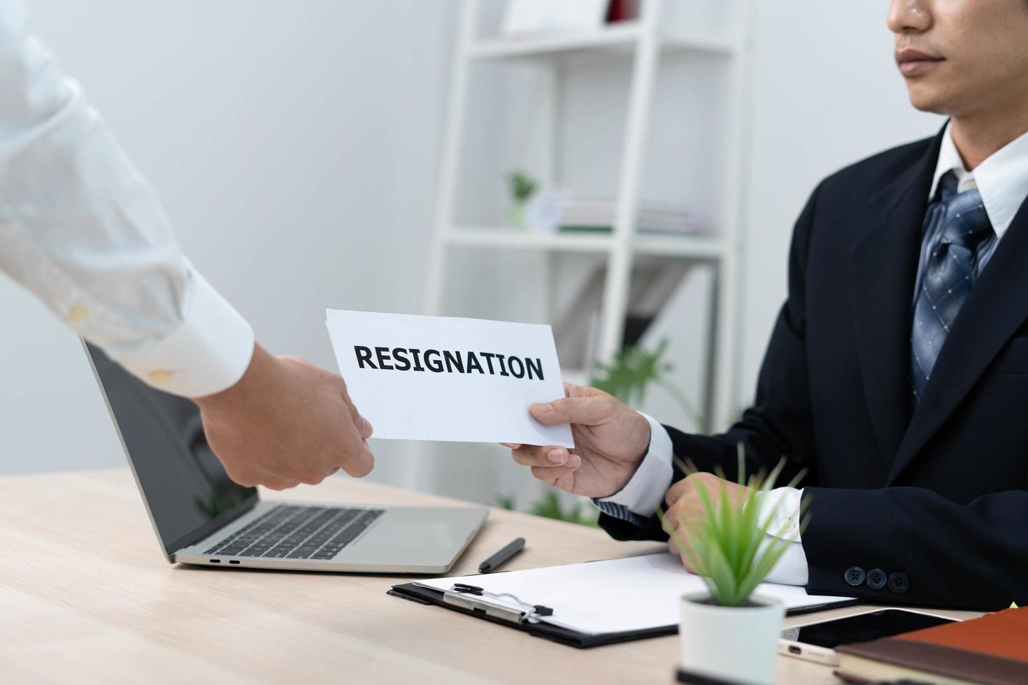 Businessmen send resignation letters to executives or managers. Include information about resignation and vacancies and job changes. photo