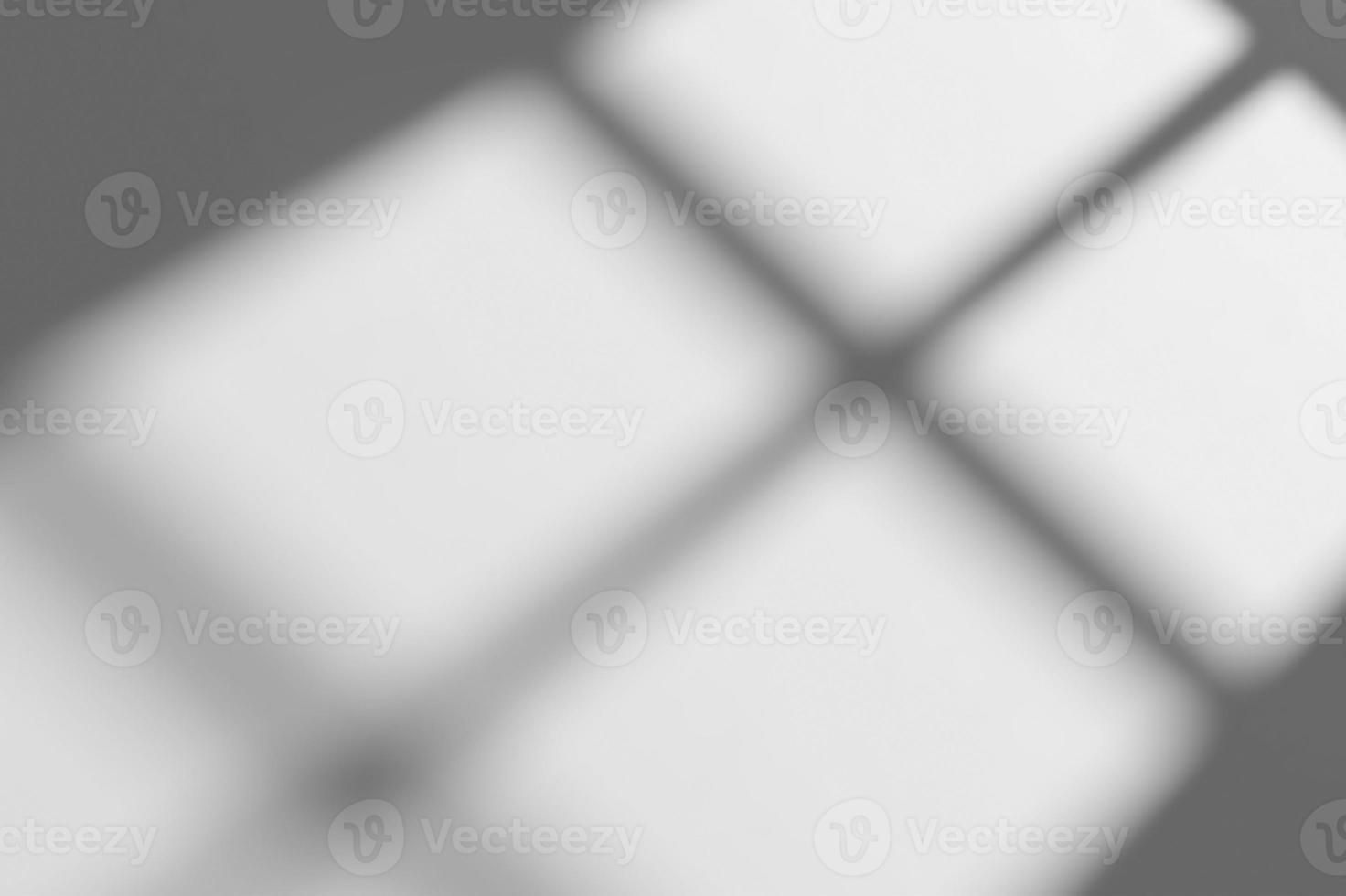 blur background. Abstract shadow of the window in morning light on white wall texture photo