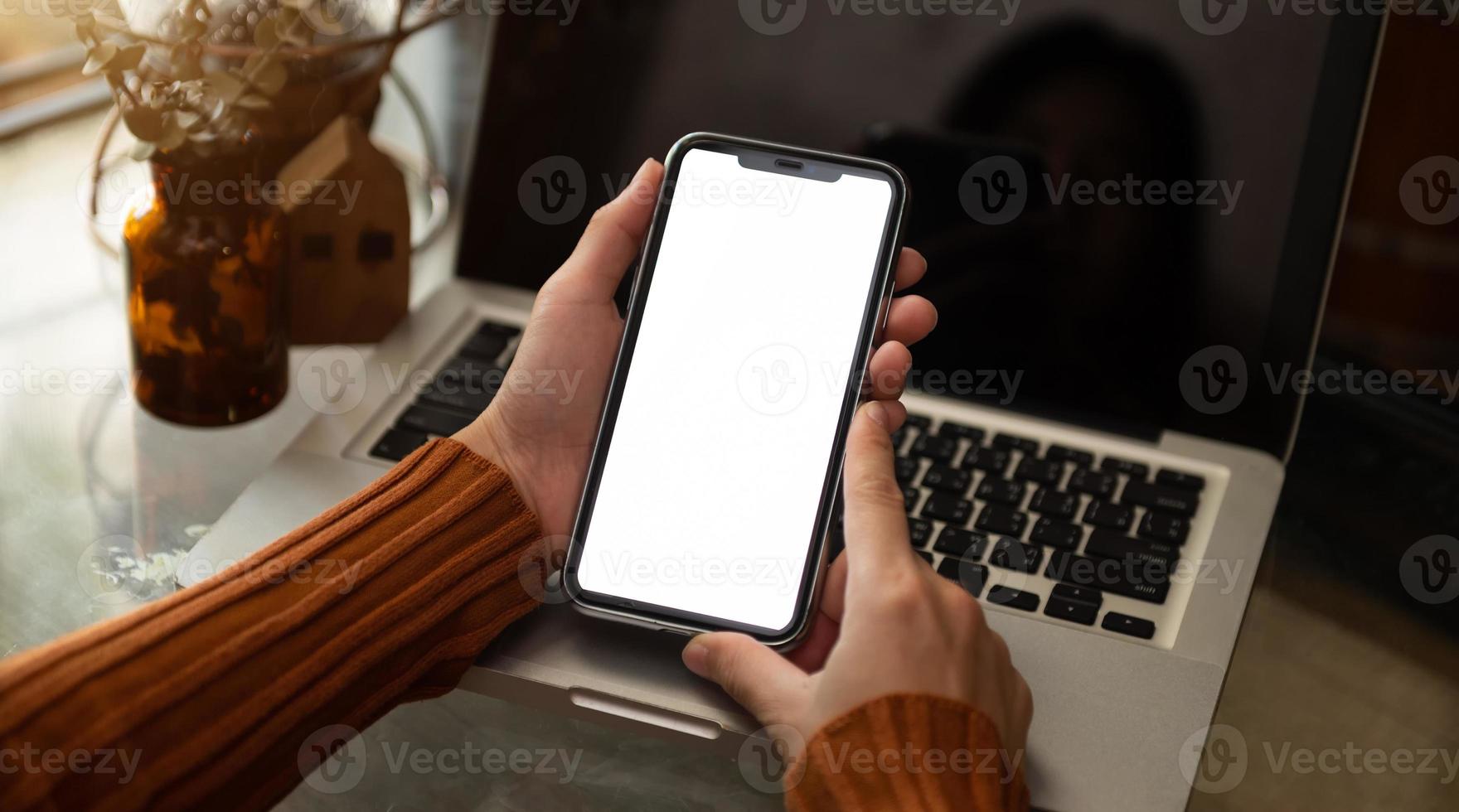 Cropped shot of female hand writing on blank tablet with pencil on office desk with clipping path laptop photo