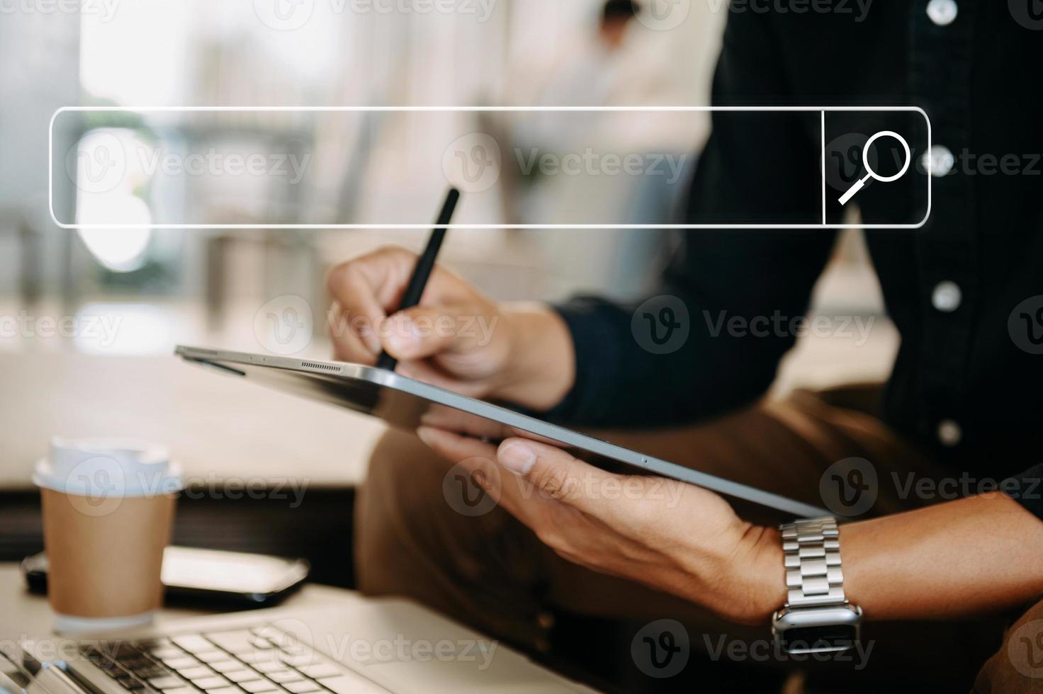 Searching Browsing Internet Data Information Networking Concept with blank search bar.man working with mobile phone and laptop computer VR icon in office photo