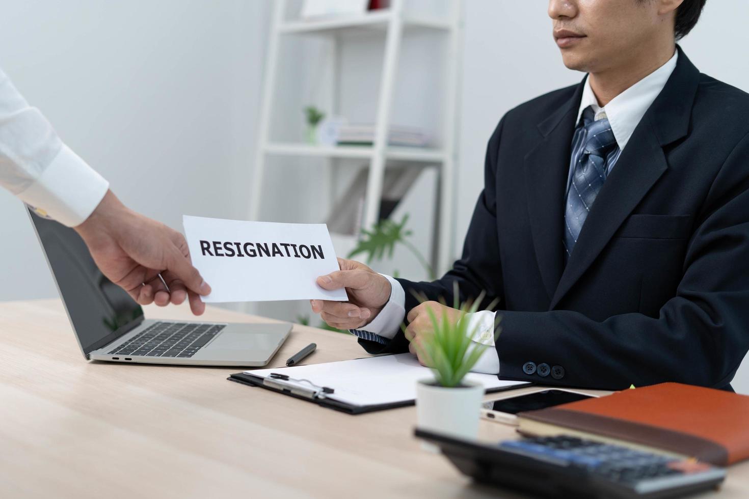 Businessmen send resignation letters to executives or managers. Include information about resignation and vacancies and job changes. photo