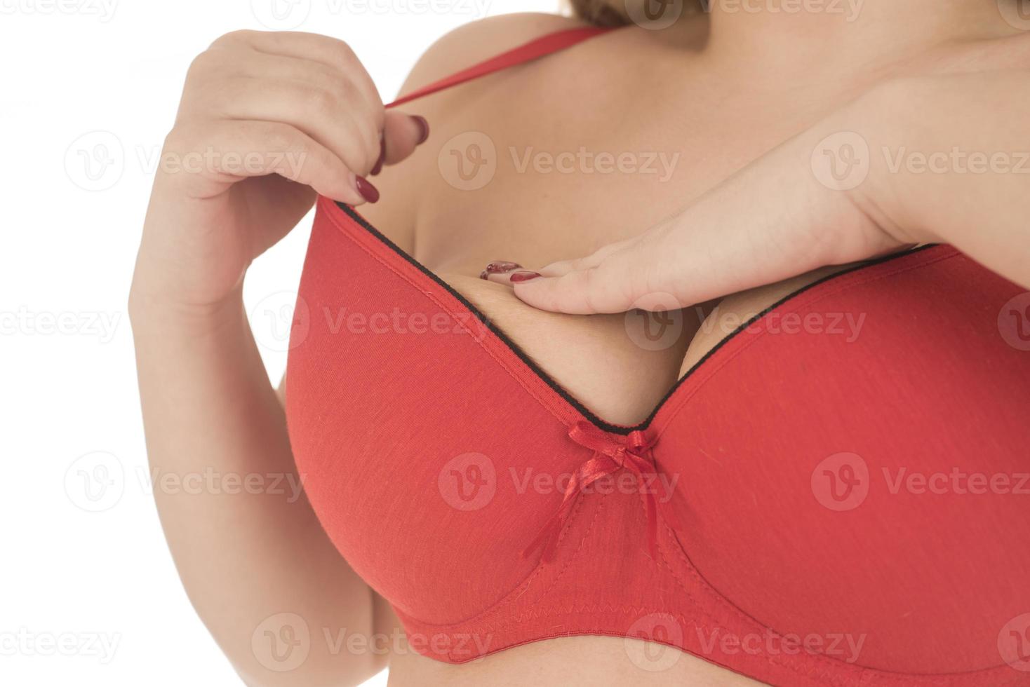 Woman Wearing A White Tank Top Checking Her Breast, Breast Self-Exam photo