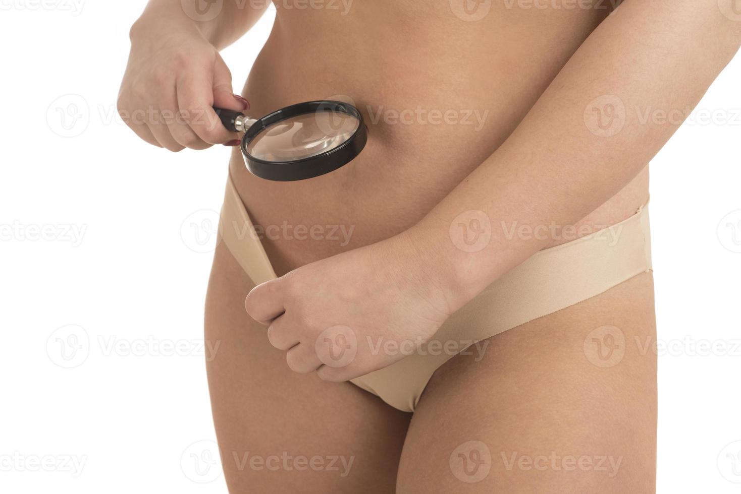 woman looks at her crotch with a magnifying glass 17155681 Stock Photo at  Vecteezy