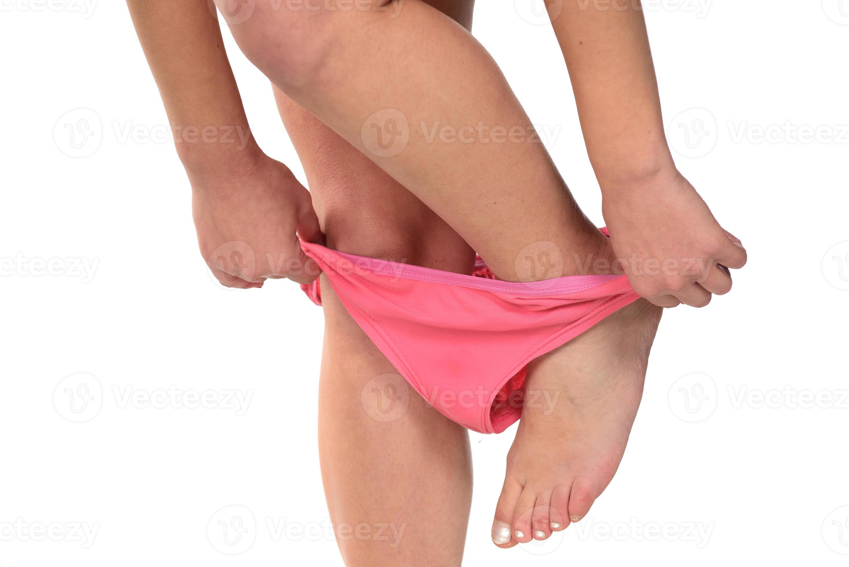Woman taking off panties