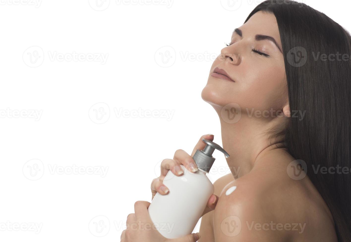 Body Care. Woman Applying Moisturizing Lotion Or Cream on her body photo