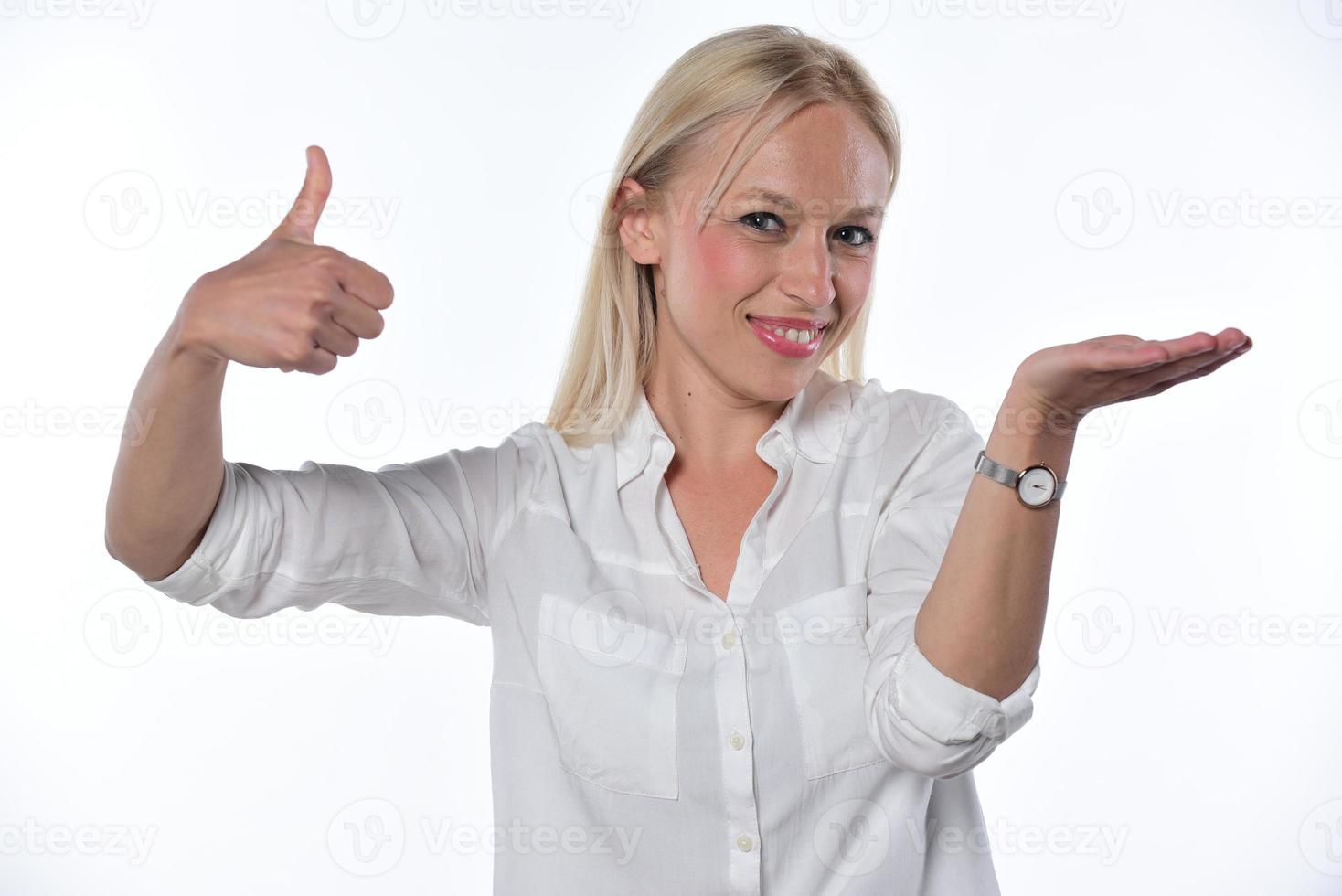 portrait of a beautiful young woman holding imaginary object on a white background photo