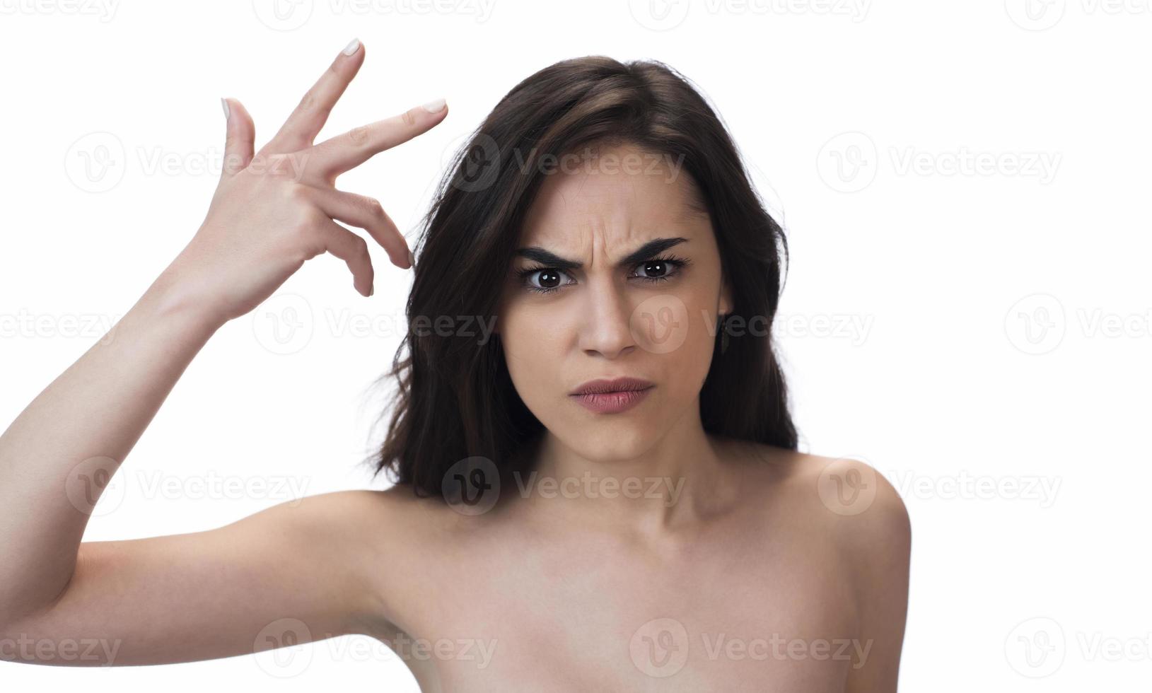 Studio shot of disappointed angry young brunette woman, Being mad, Blaming all her failures on you photo