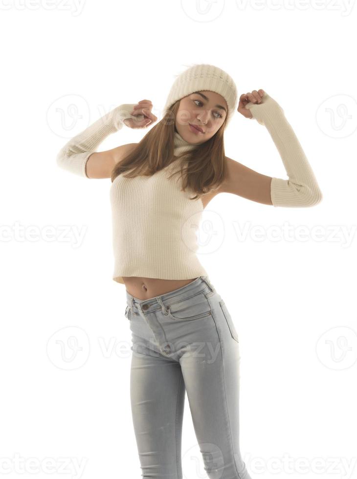 Smiling funny young positive woman 20s in warm white basic sweater hat posing in studio photo