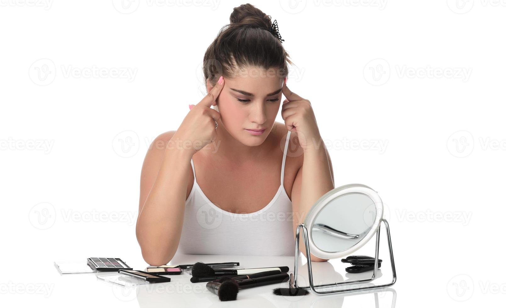 Girl with low self esteem checking her skin in a mirror banner. photo