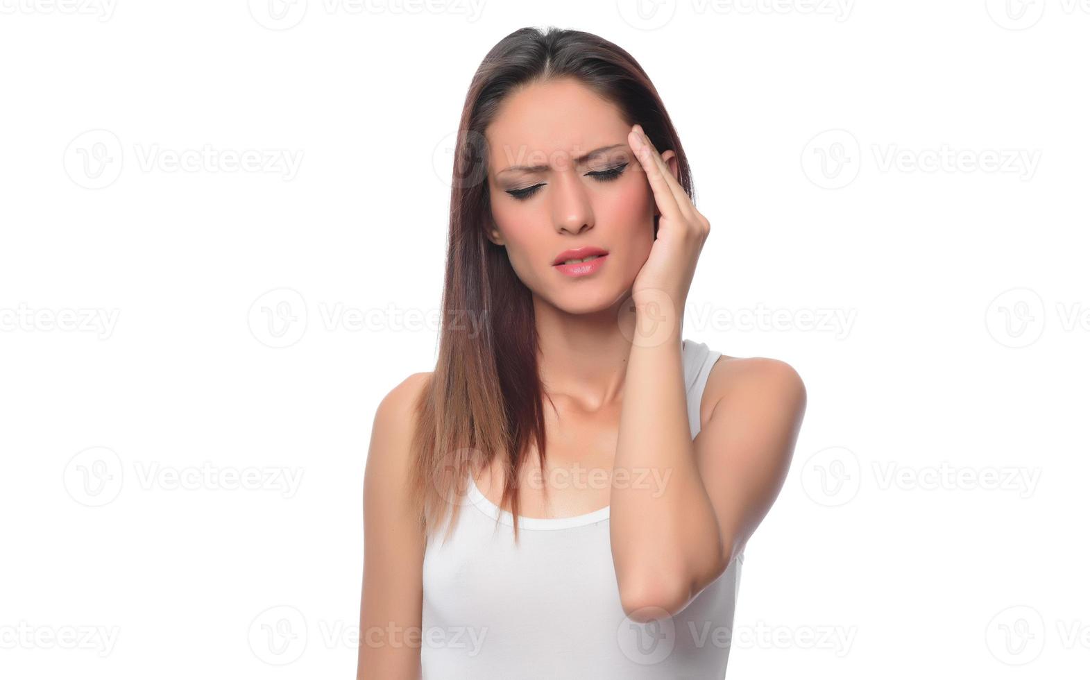 Sad tired young woman touching forehead having headache migraine or depression, upset frustrated girl troubled with problem feel stressed cover crying face with hand suffer from grief sorrow concept photo