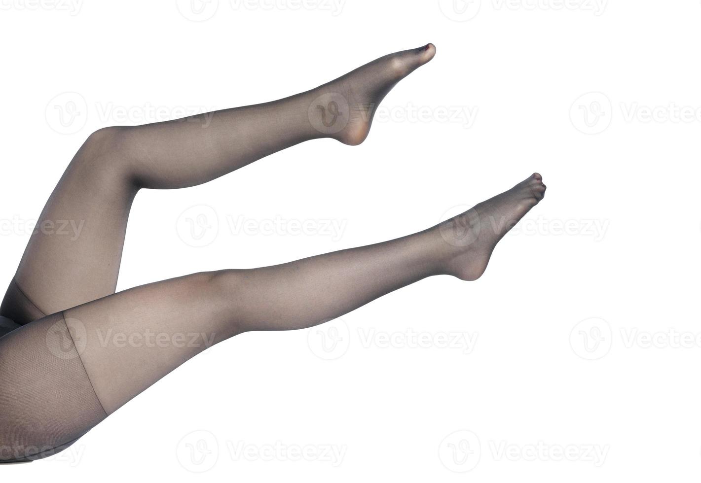 Beautiful well-groomed women's legs close-up on a white isolated background, photo