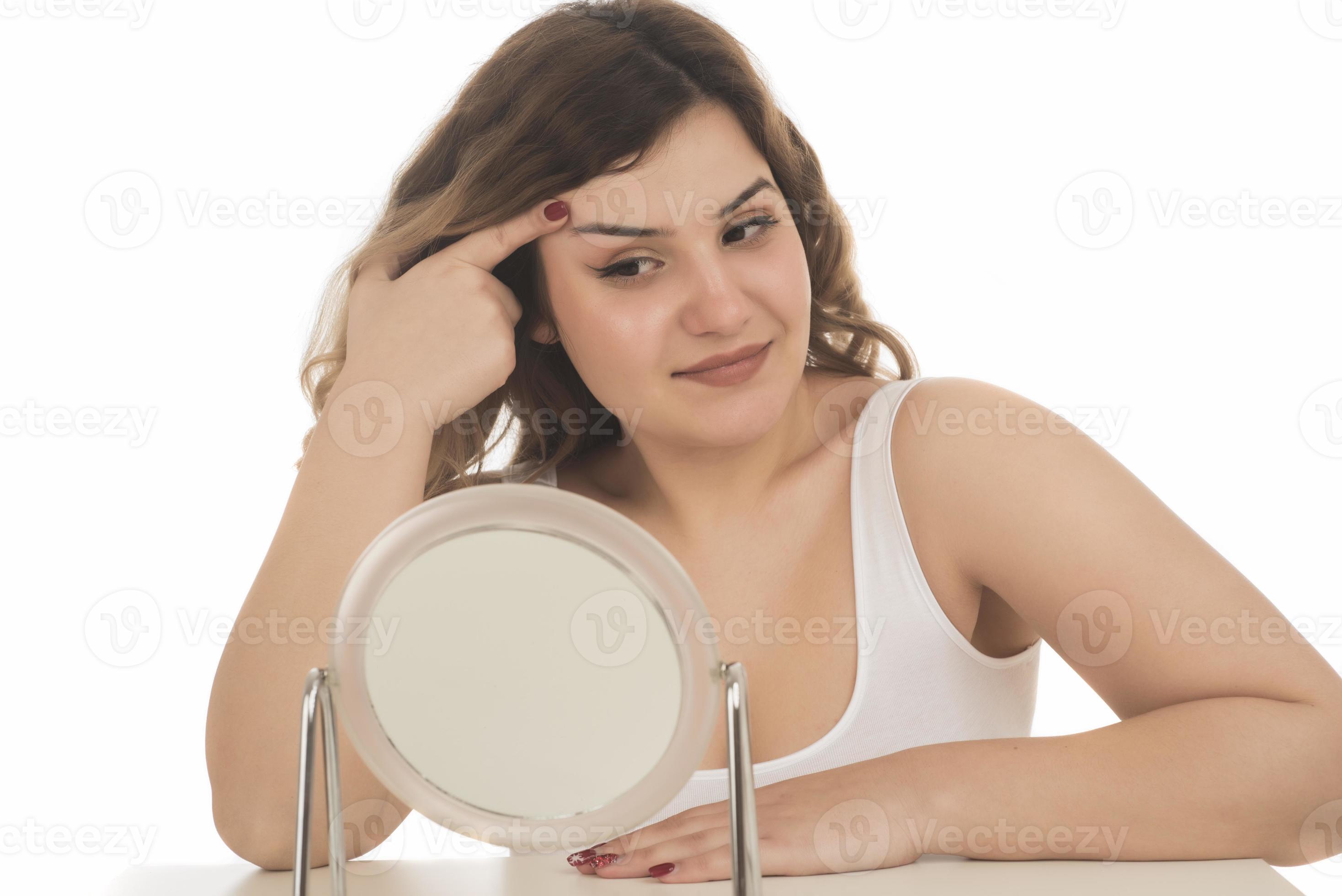 Portrait of pretty charming attractive girl look in mirror touch hands