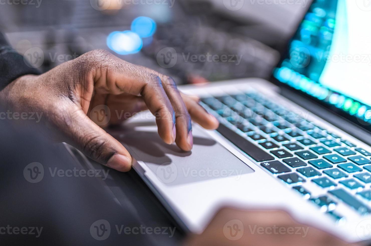 DJ plays live set and mixing music on laptop. Disc Jokey Hands on a laptop at club. photo