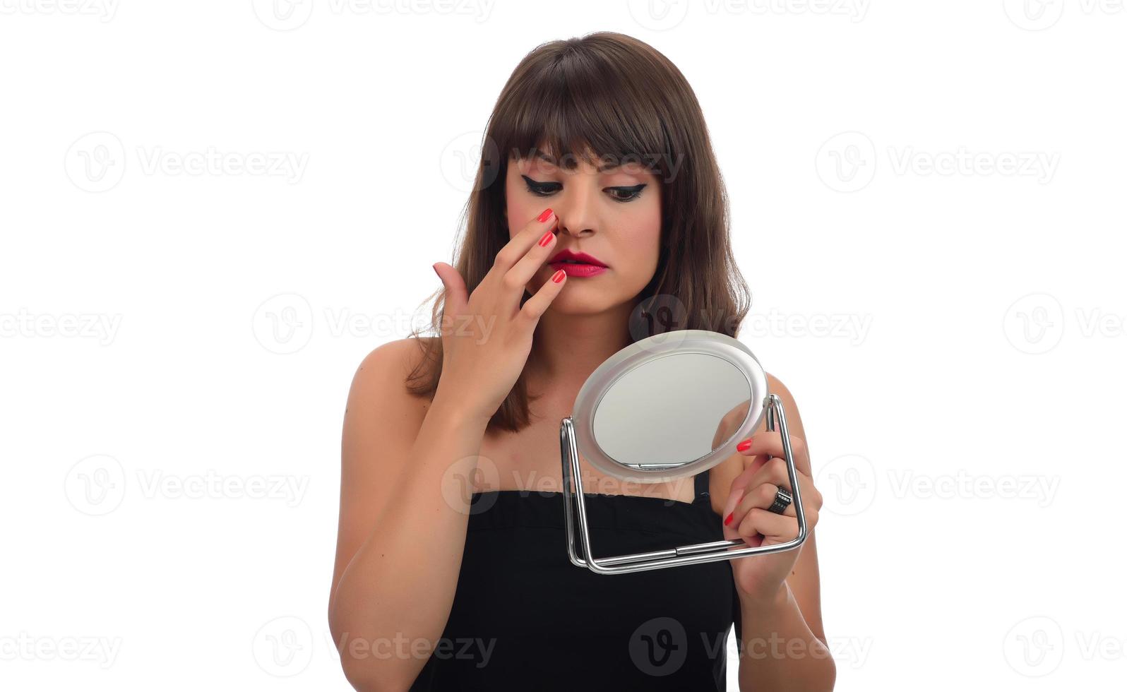 Girl with low self esteem checking her skin in a mirror banner. photo