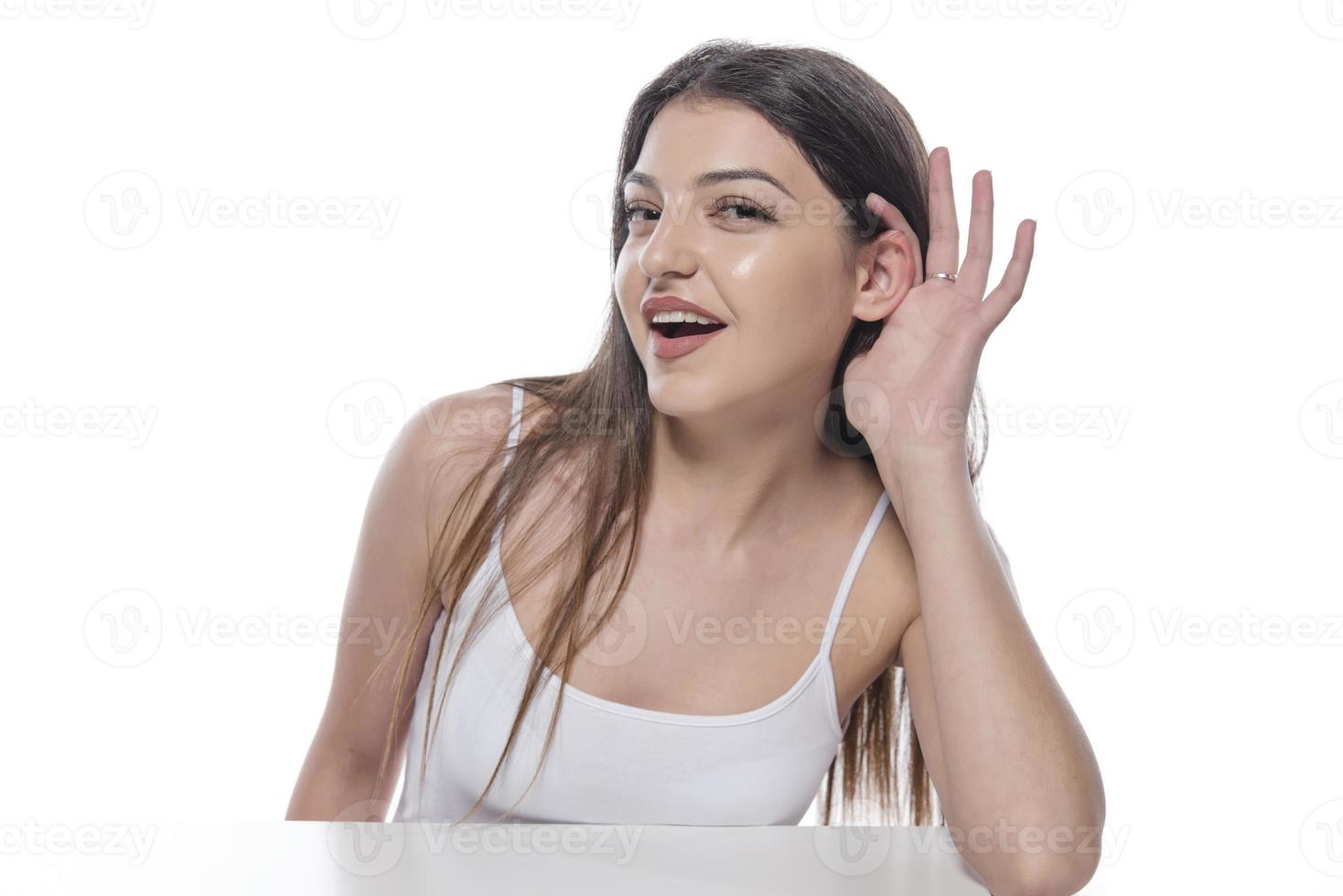 woman suffers from hearing impairment, hard of hearing, hearing loss photo