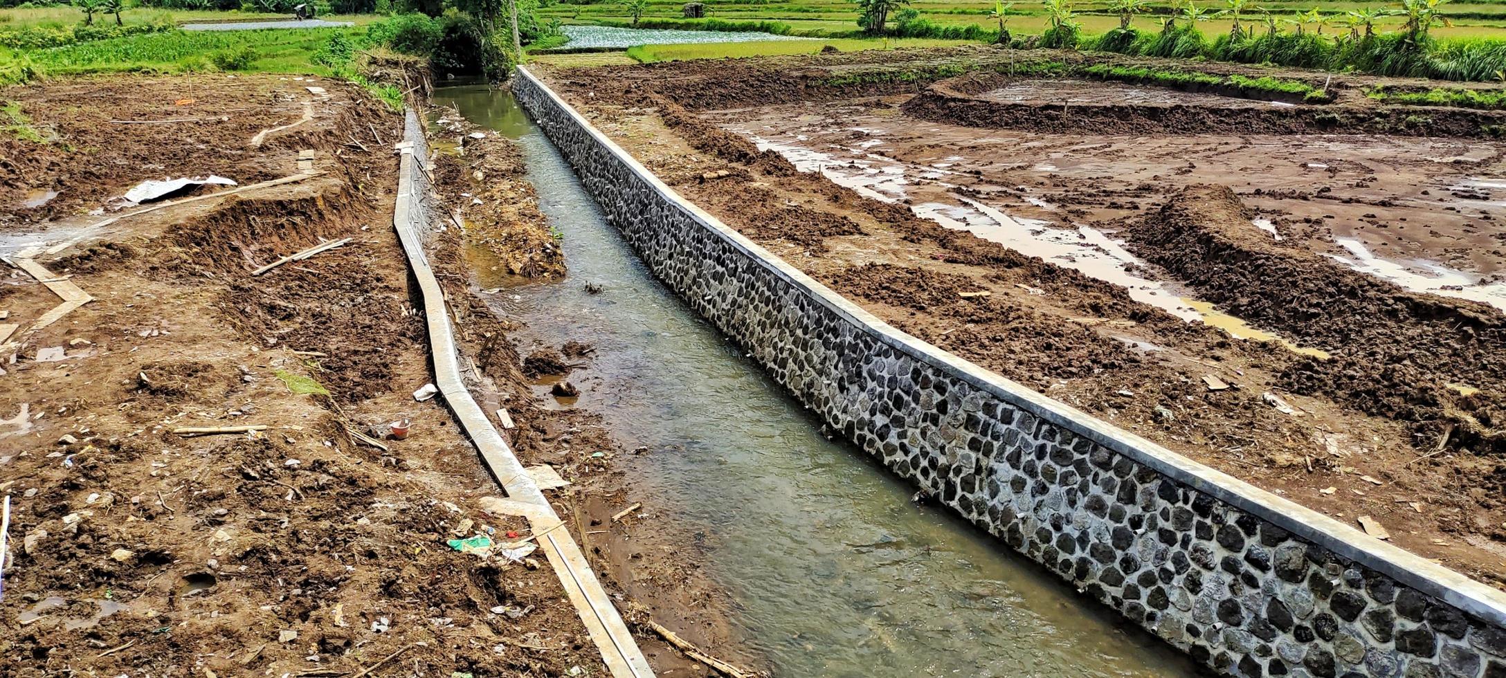 The river flows from Mount Andong in Grabag, Central Java. The local community built embankments or fortifications around the riverbanks to prevent erosion photo