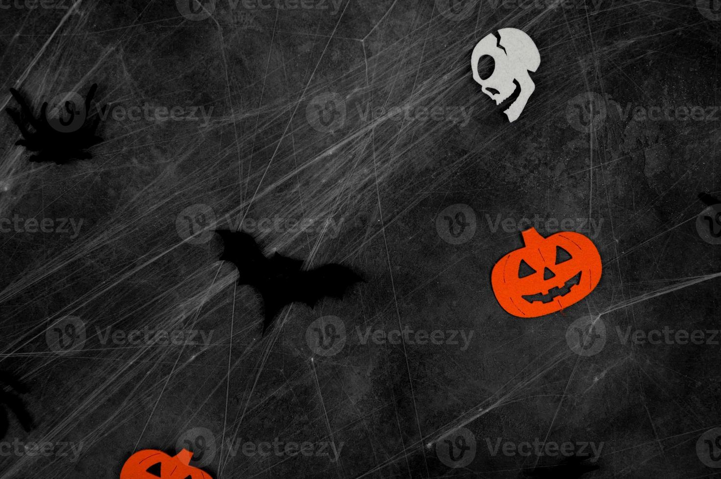 Mystery halloween background with bats,spiders,skulls and spider web.Black,white,and orange banner photo