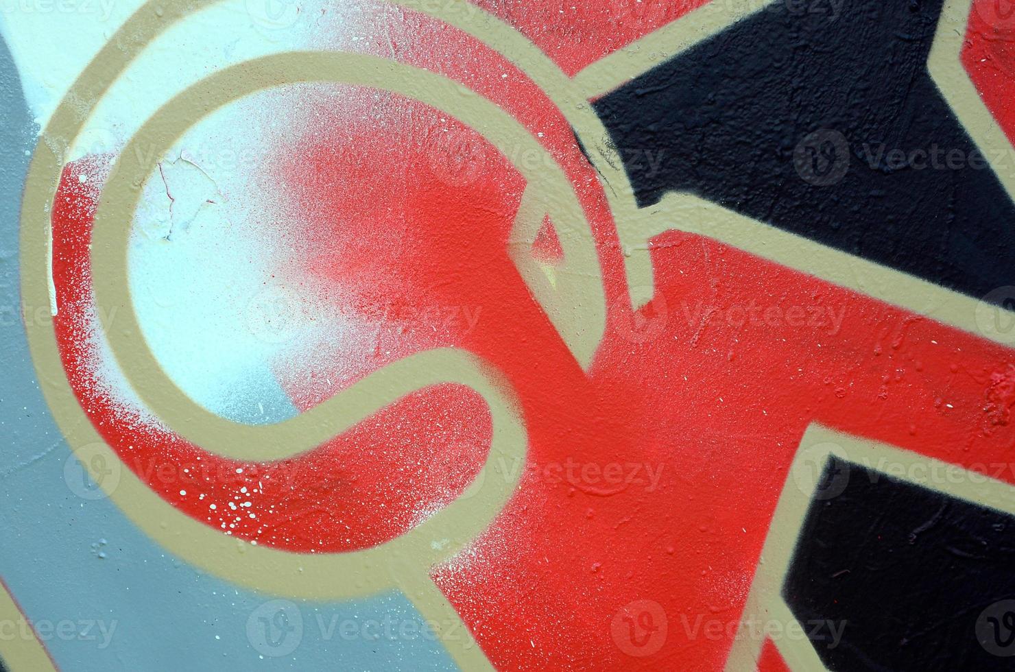 Street art. Abstract background image of a fragment of a colored graffiti painting in red tones photo