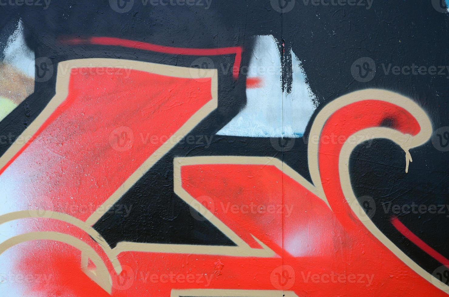 Street art. Abstract background image of a fragment of a colored graffiti painting in red tones photo