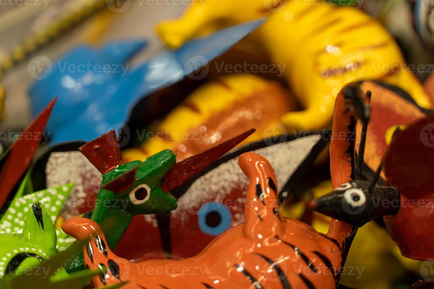 Alebrije, trancelate Mexical art craft in Oaxaca traditional colorful toys from mexico photo