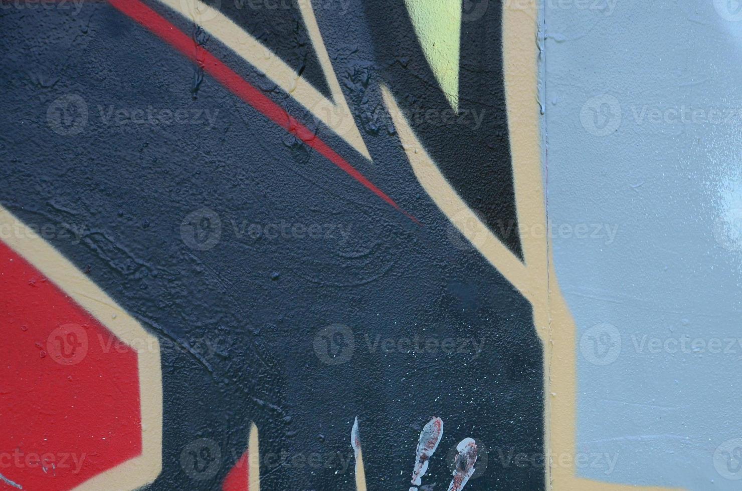 Street art. Abstract background image of a fragment of a colored graffiti painting in dark grey and red tones photo