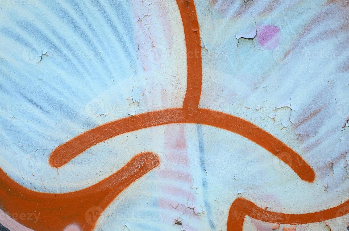 Street art. Abstract background image of a fragment of a colored graffiti painting in white and orange tones photo
