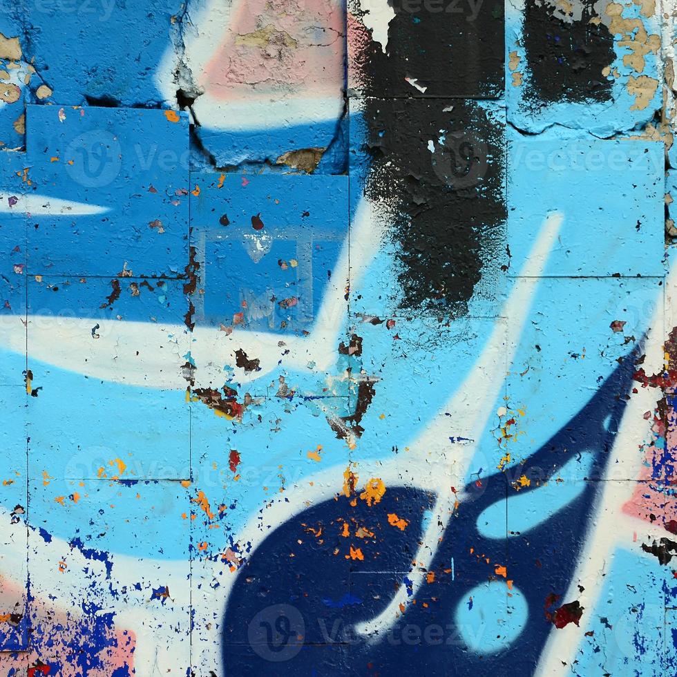 Street art. Abstract background image of a fragment of a colored graffiti painting in blue tones photo