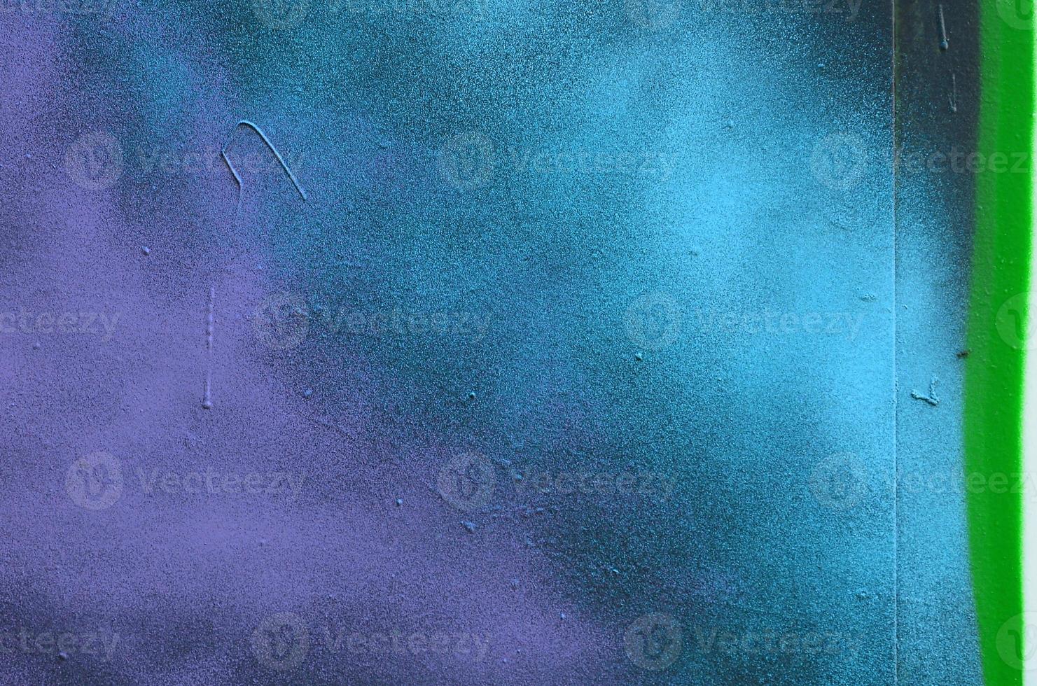 Street art. Abstract background image of a fragment of a colored graffiti painting in cosmic blue and violet tones photo