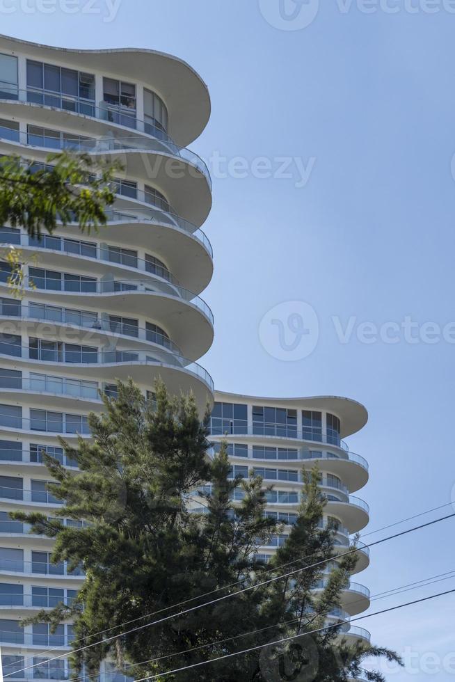Modern apartment buildings on a sunny day with a blue sky. Facade of a modern apartment building photo