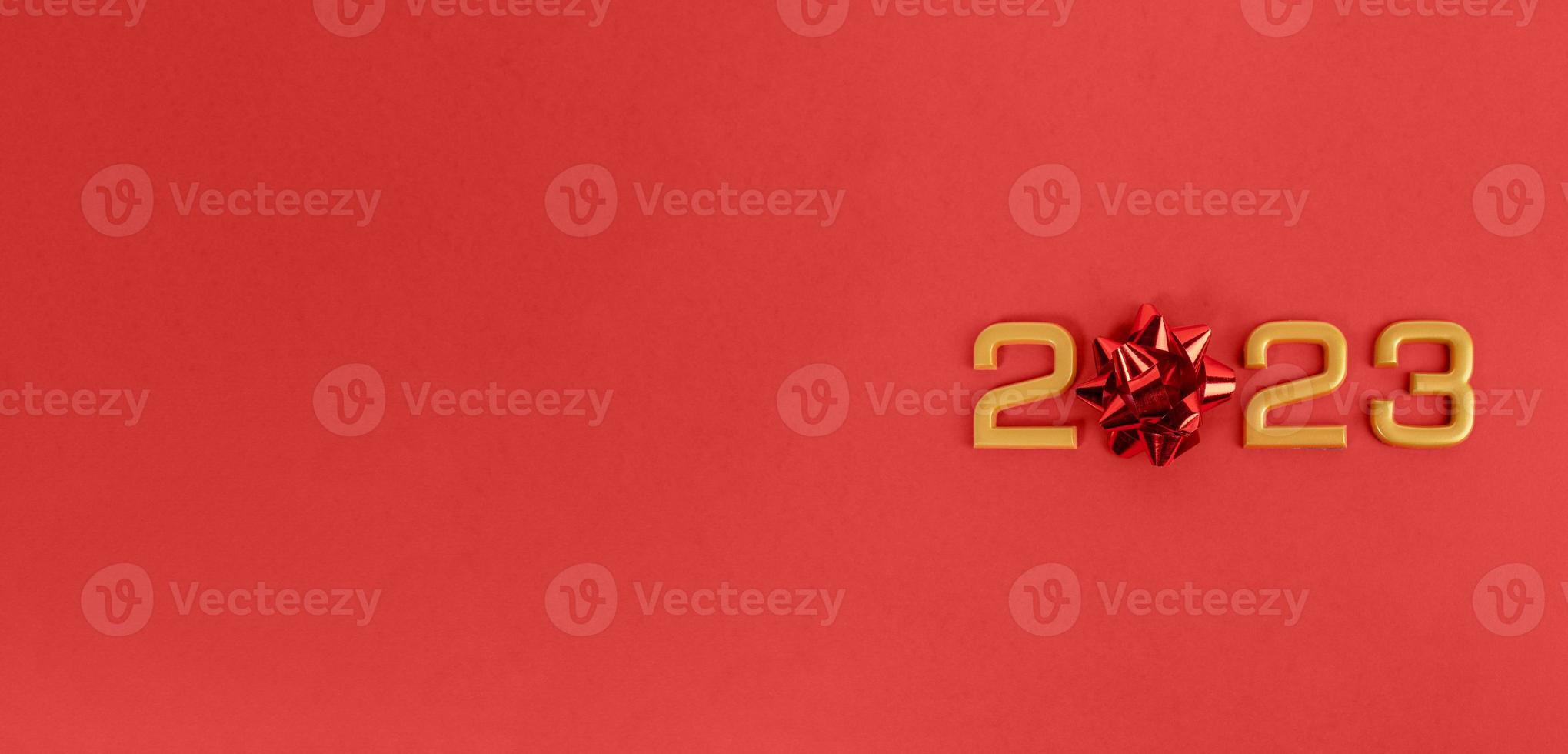 Numbers 2023 on a red background. New Year and Christmas concept. Banner, copy space photo