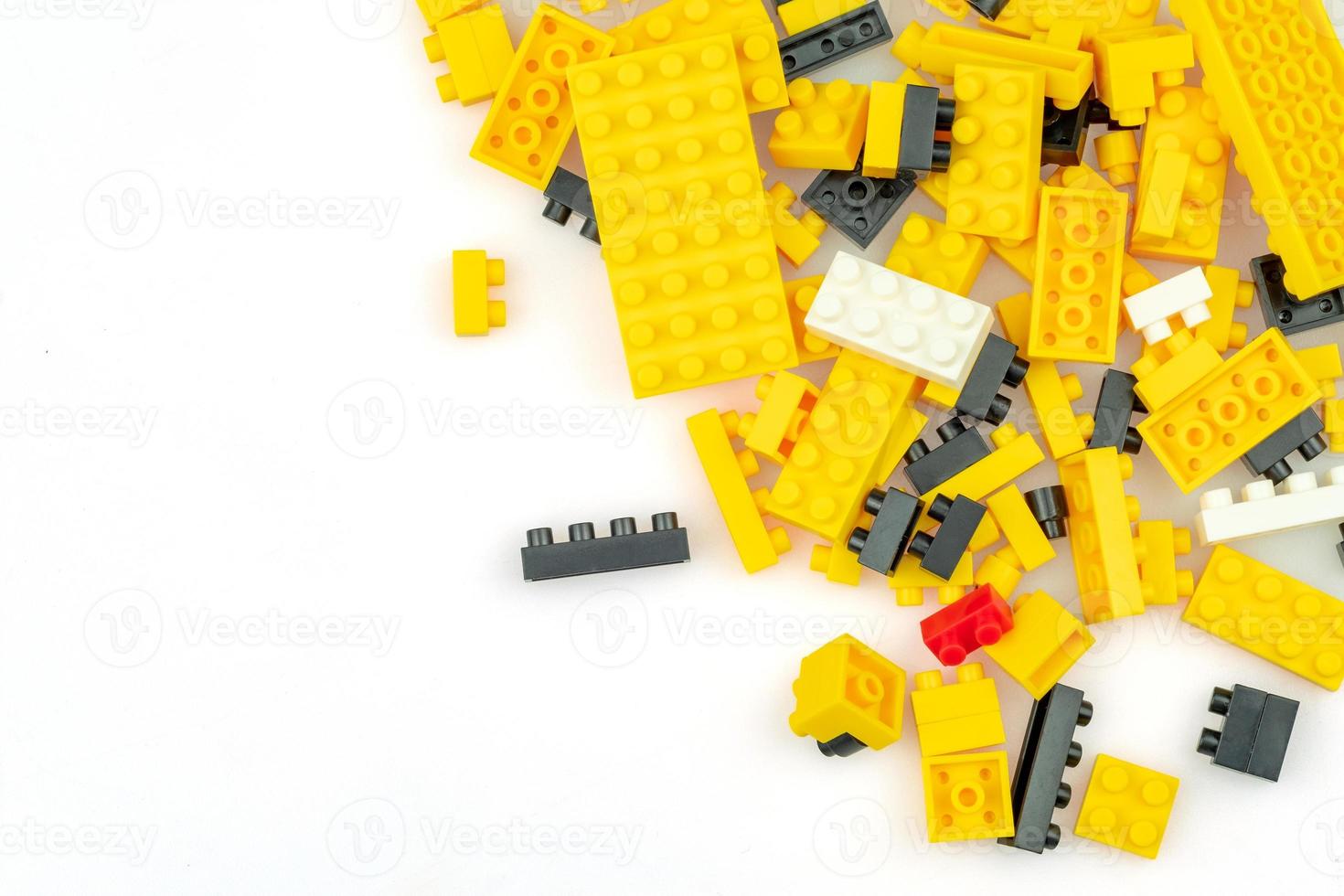 Educational toys for kids mockup, Colorful plastic bricks blocks on white background. copy space. children's creativity education concept, top view photo