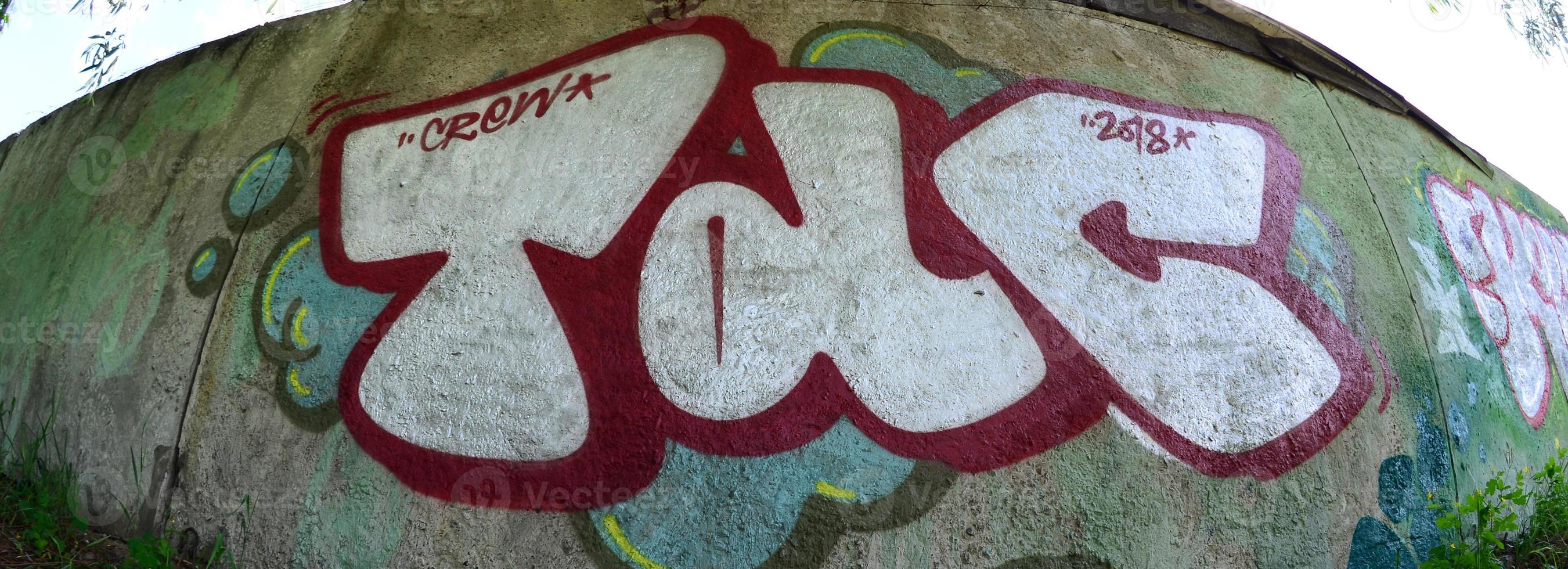 Street art. Abstract background image of a full completed graffiti painting in chrome fill, green background and red outlines. Fisheye photo