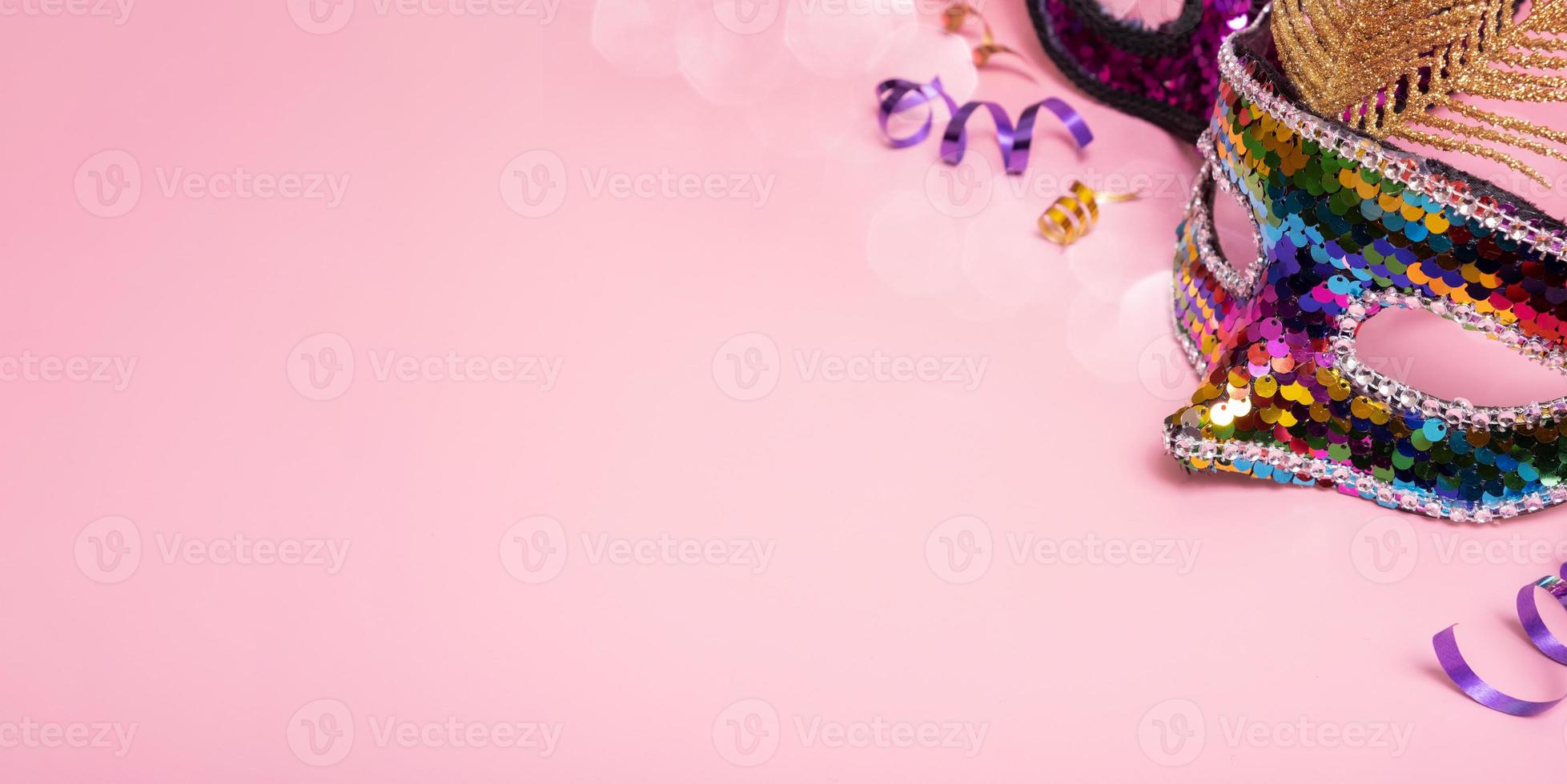 Banner with festive face mask for carnival celebration on colored background photo