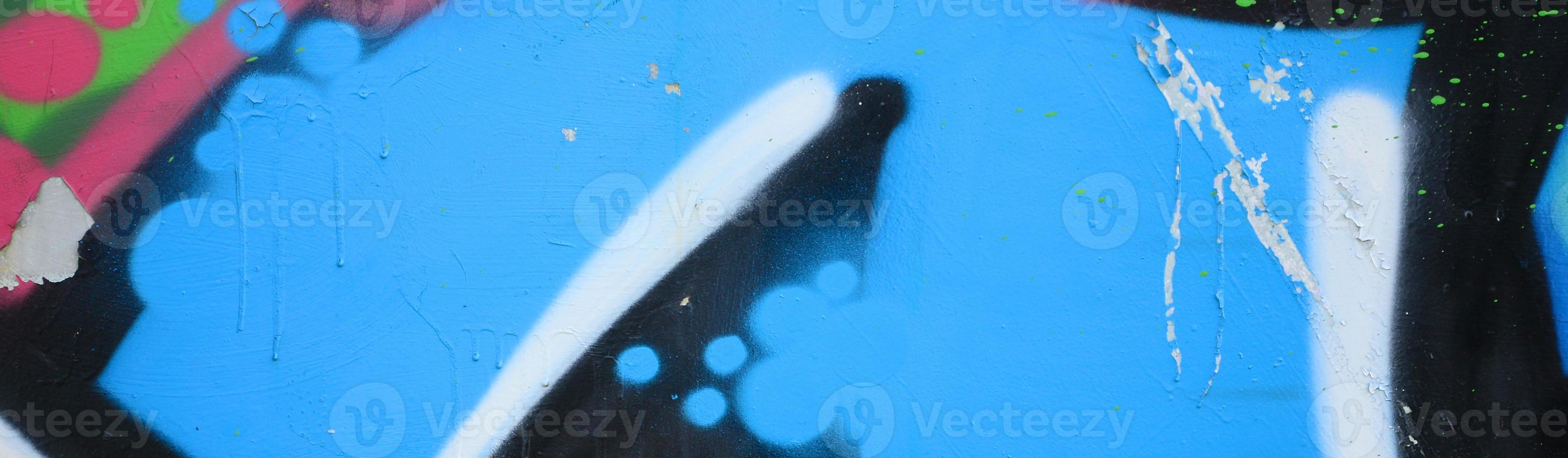 Street art. Abstract background image of a fragment of a colored graffiti painting in blue tones photo