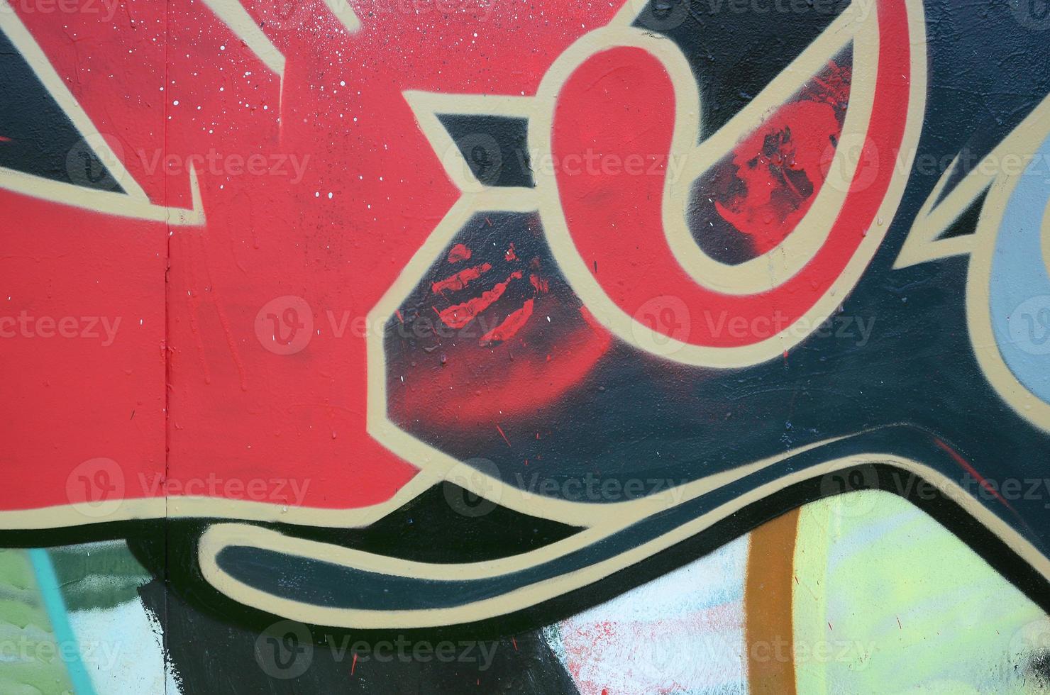 Street art. Abstract background image of a fragment of a colored graffiti painting in red tones photo