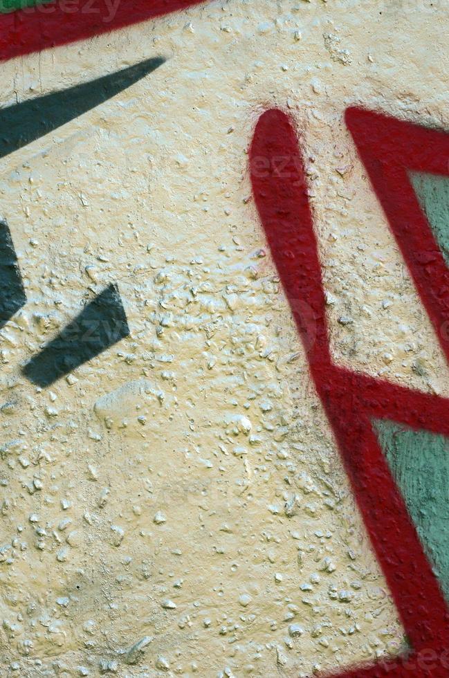 Street art. Abstract background image of a fragment of a colored graffiti painting in chrome and red tones photo