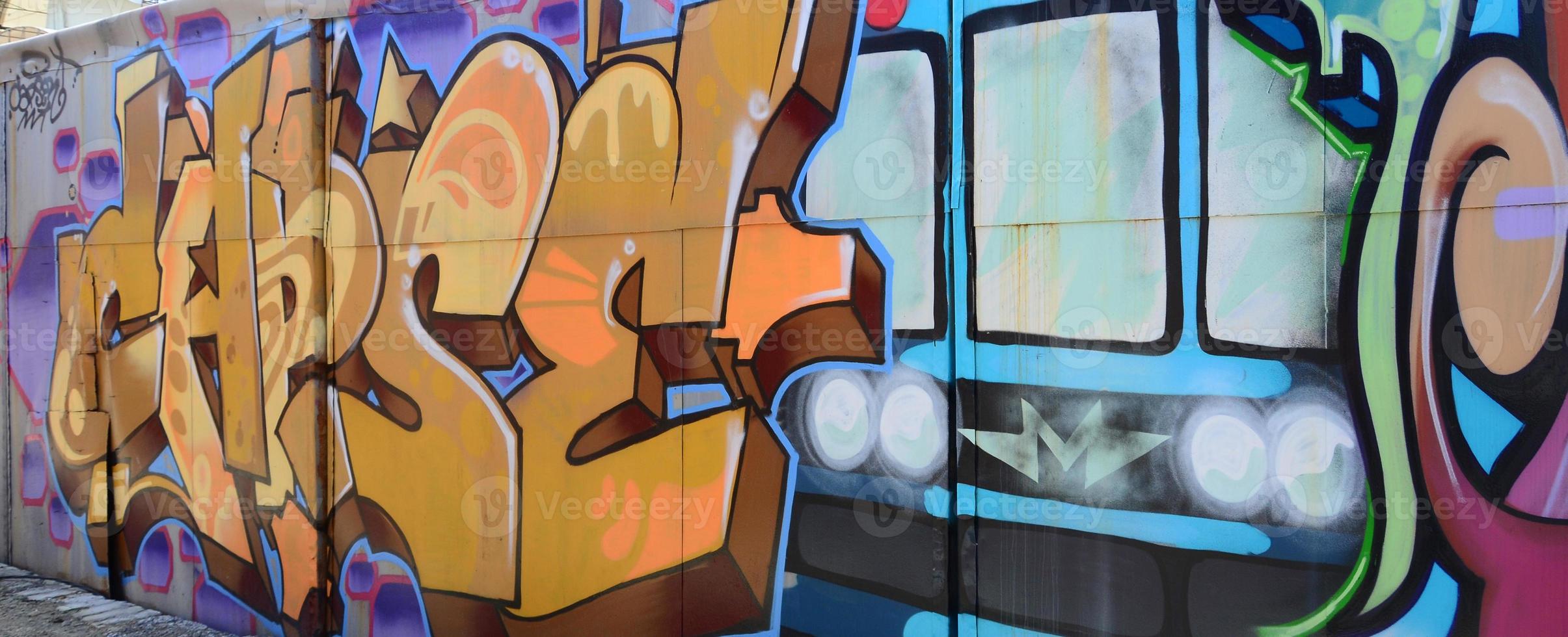 Street art. Abstract background image of a full completed graffiti painting in beige and orange tones with the subway train photo