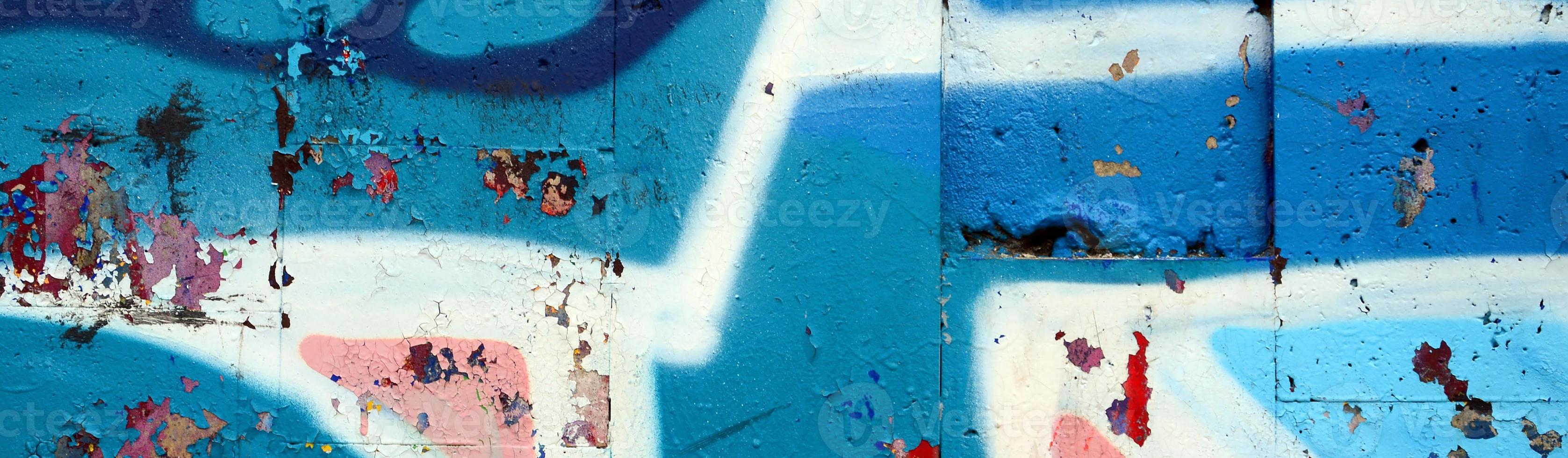 Street art. Abstract background image of a fragment of a colored graffiti painting in blue tones photo