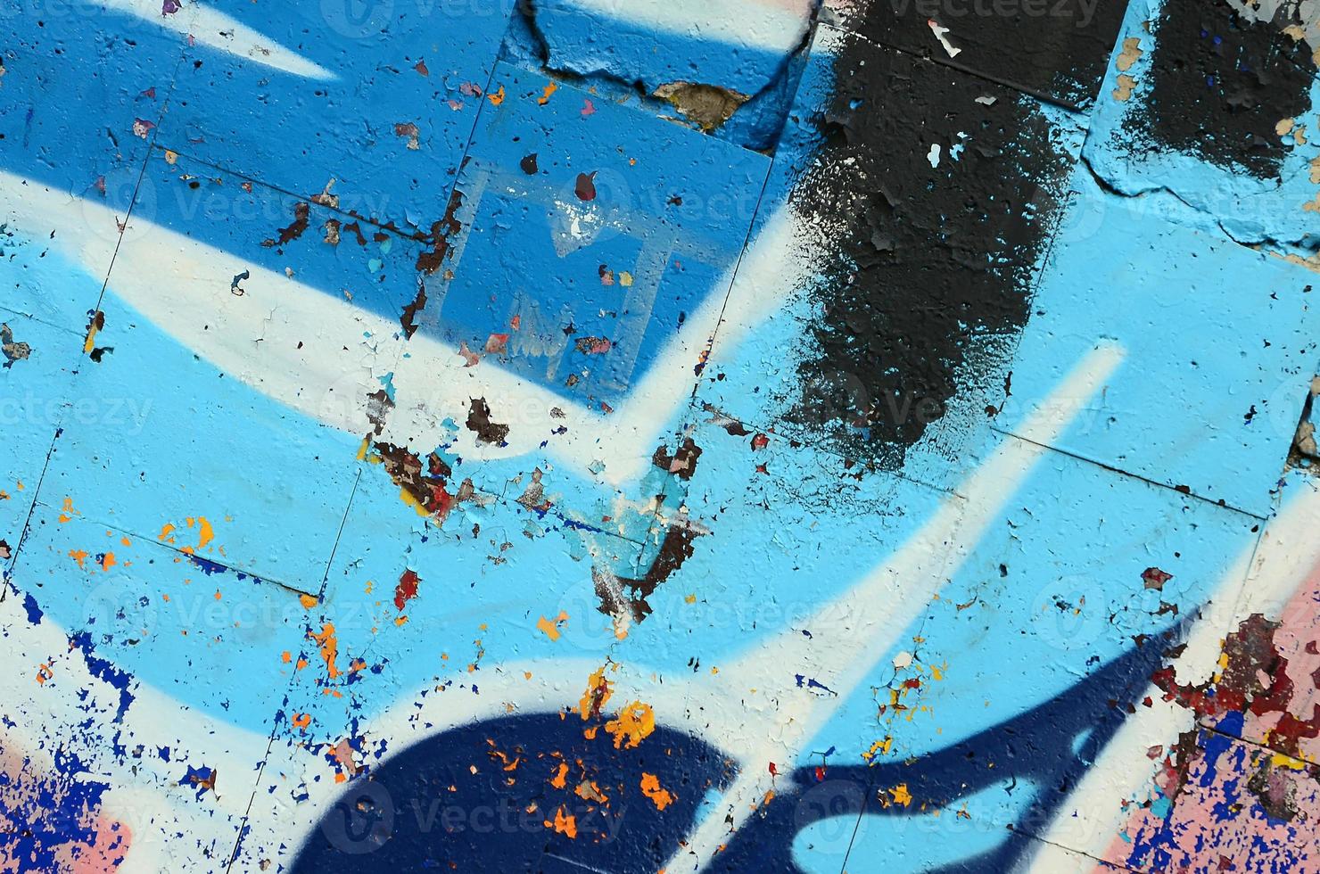 Street art. Abstract background image of a fragment of a colored graffiti painting in blue tones photo