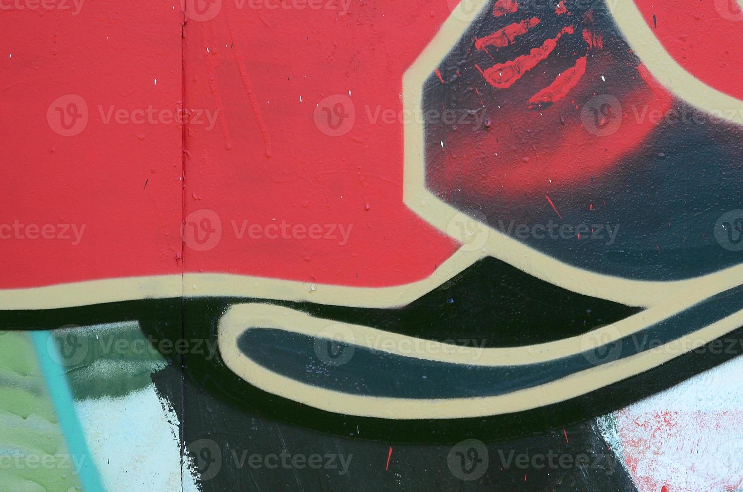 Street art. Abstract background image of a fragment of a colored graffiti painting in red tones photo