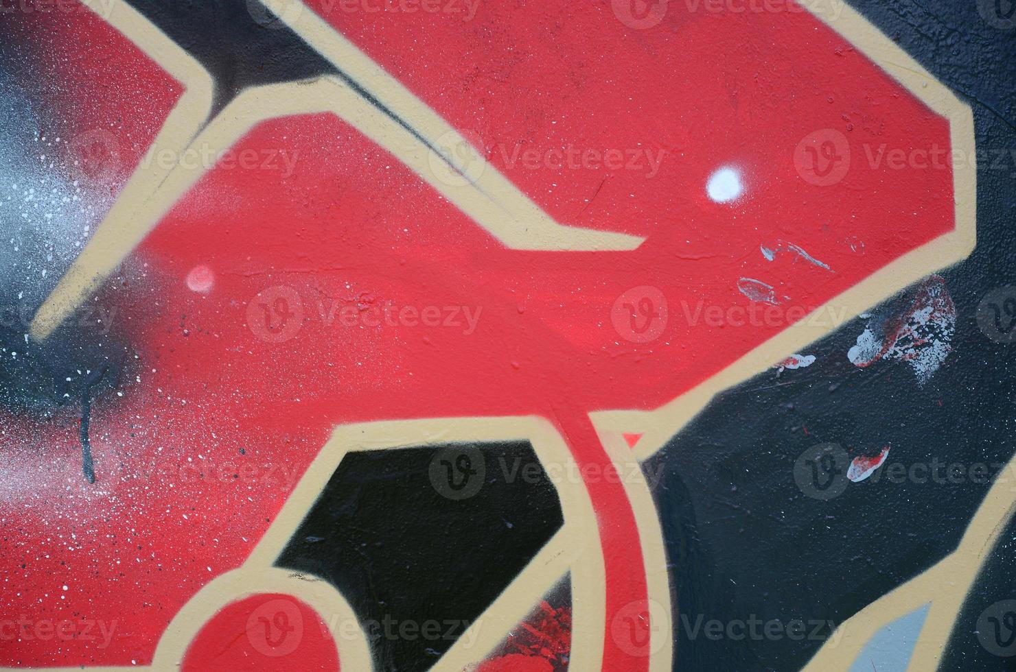 Street art. Abstract background image of a fragment of a colored graffiti painting in red tones photo