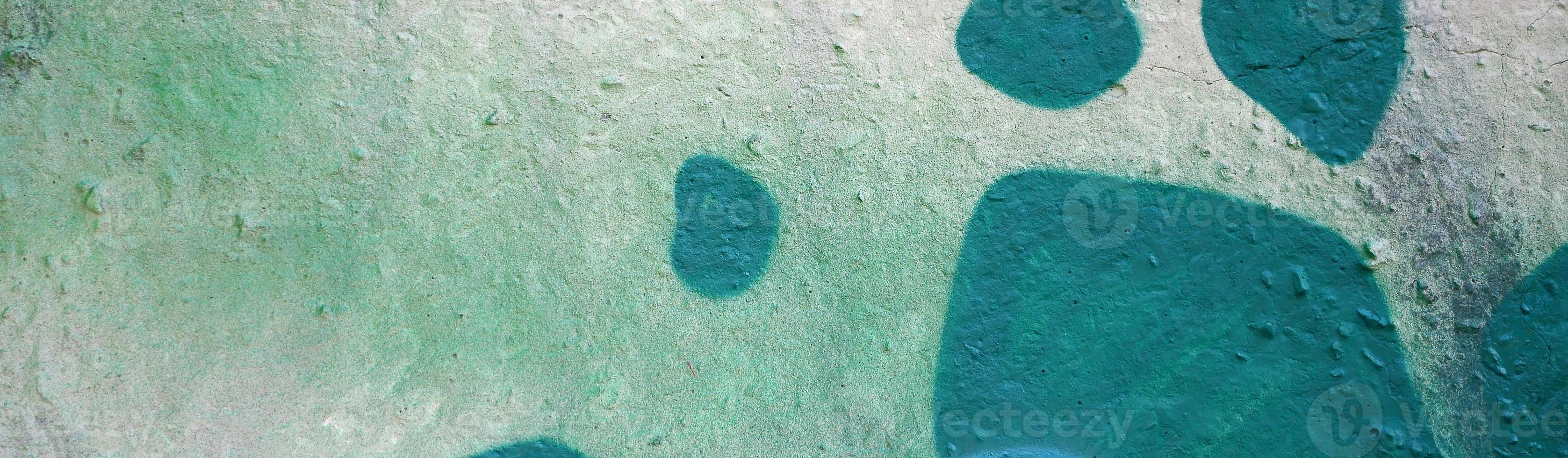 Street art. Abstract background image of a fragment of a colored graffiti painting in khaki green and orange tones photo