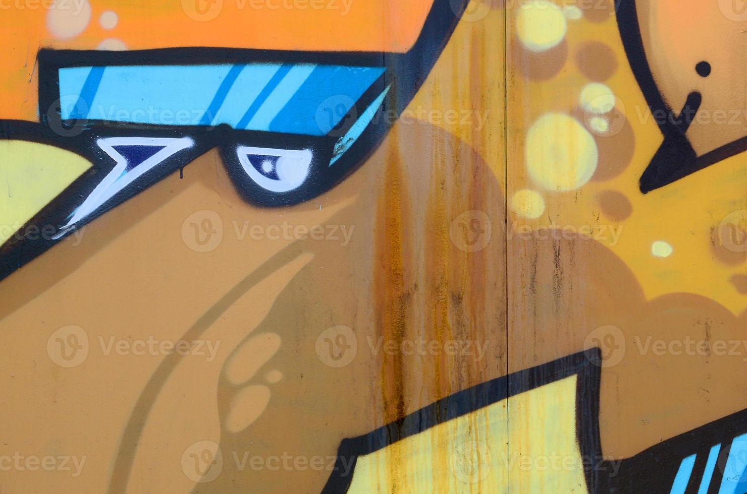 Street art. Abstract background image of a fragment of a colored graffiti painting in beige and orange tones photo