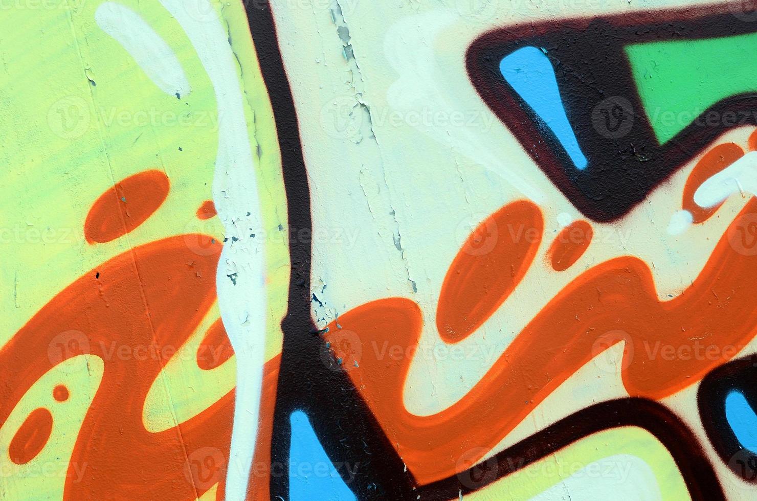 arte callejero. imagen de fondo abstracta de un fragmento de una pintura de graffiti coloreada en tonos verde caqui y naranja foto