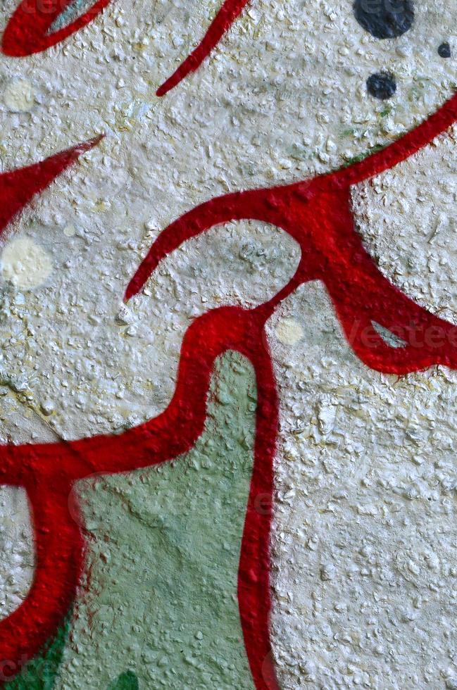 Street art. Abstract background image of a fragment of a colored graffiti painting in chrome and red tones photo