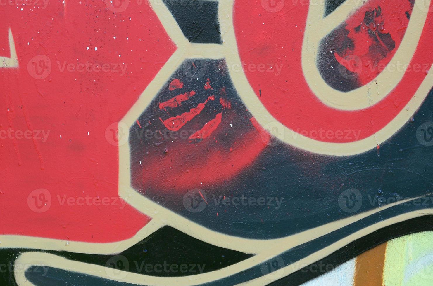 Street art. Abstract background image of a fragment of a colored graffiti painting in red tones photo