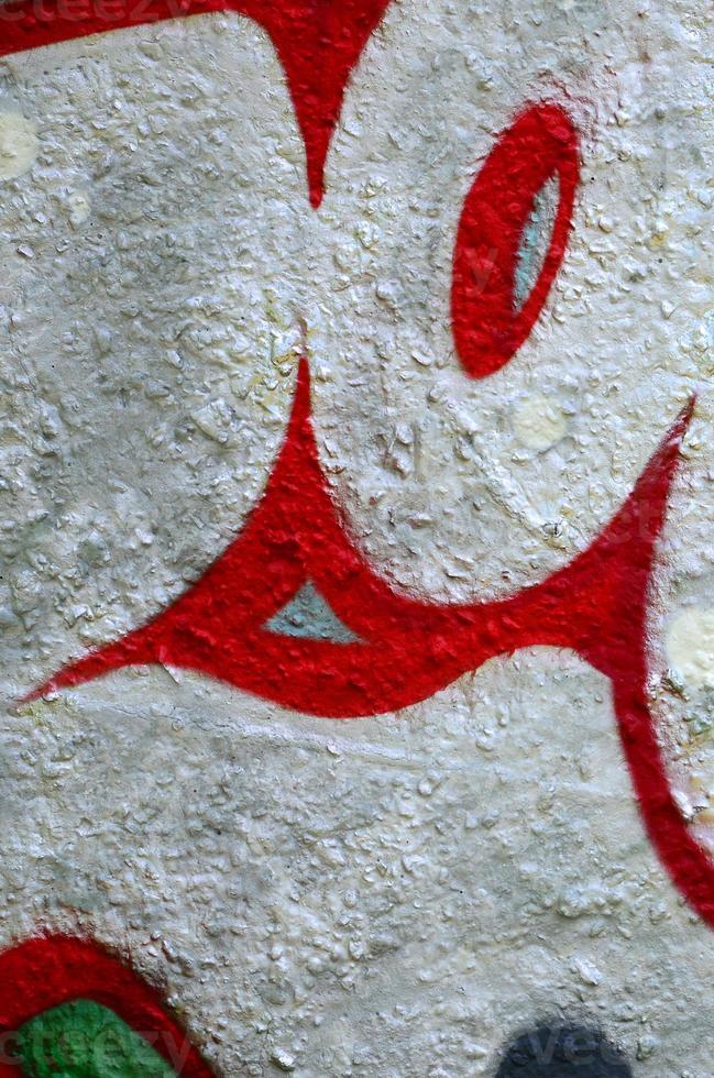 Street art. Abstract background image of a fragment of a colored graffiti painting in chrome and red tones photo