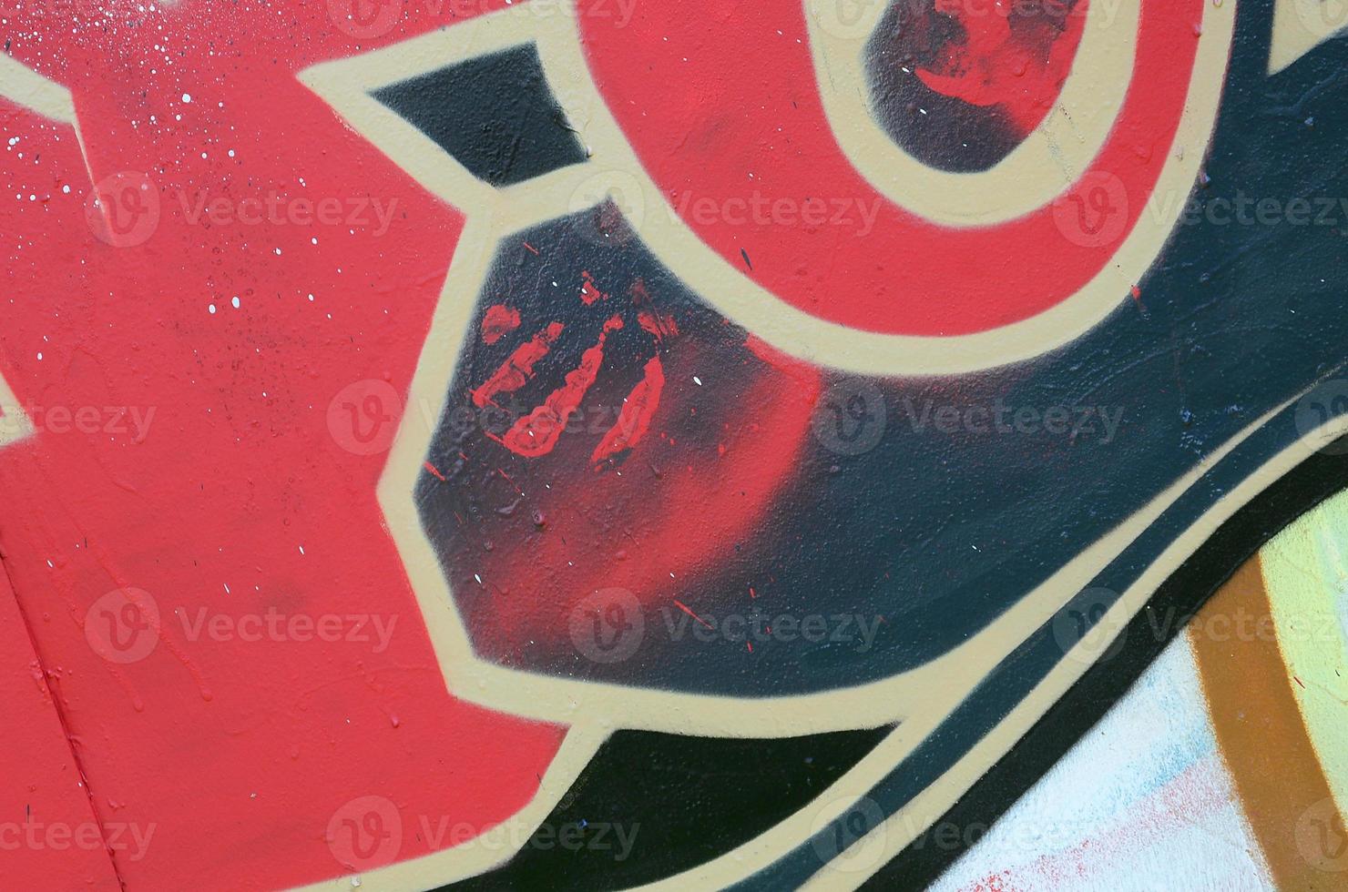 Street art. Abstract background image of a fragment of a colored graffiti painting in red tones photo