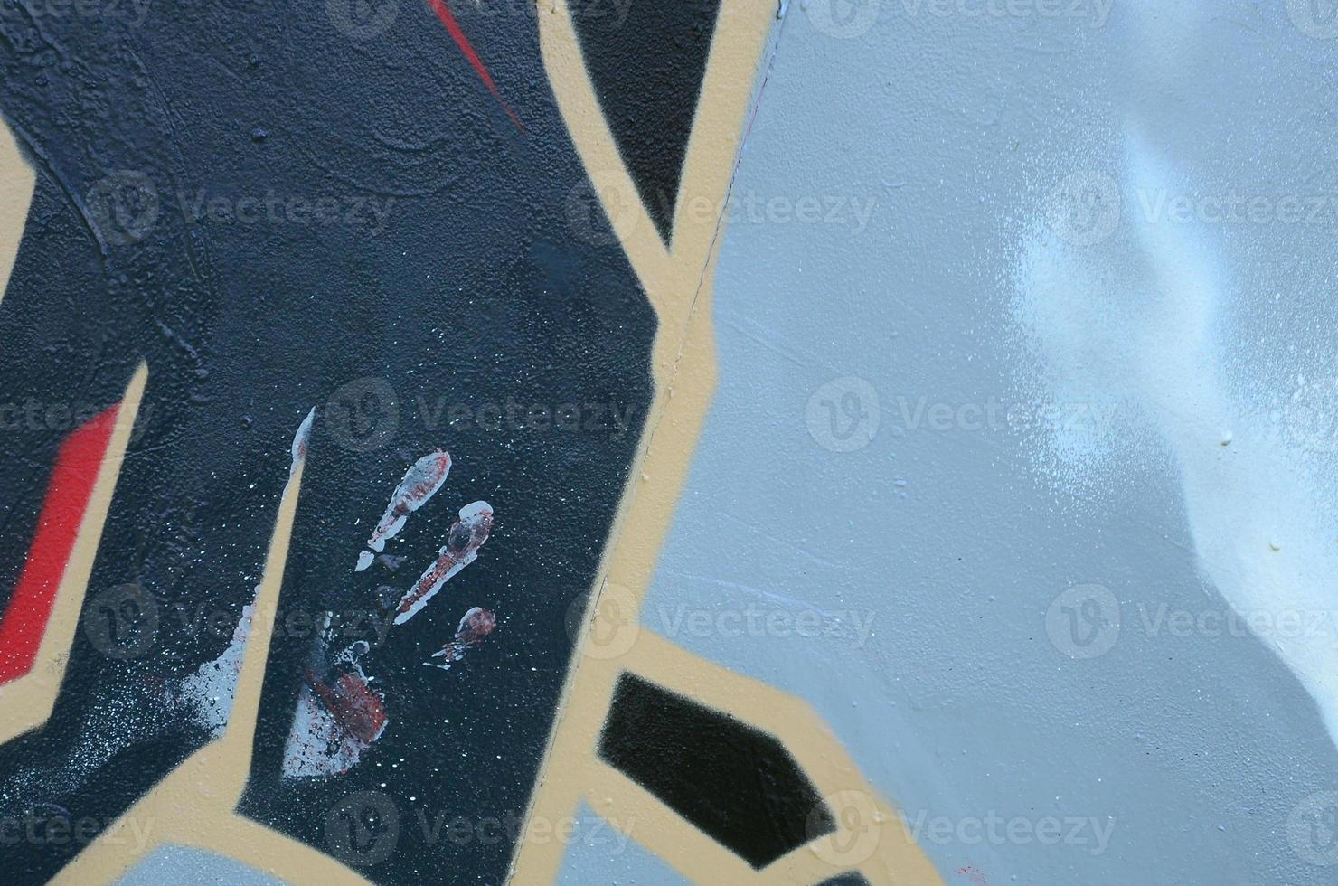 Street art. Abstract background image of a fragment of a colored graffiti painting in dark grey and red tones photo